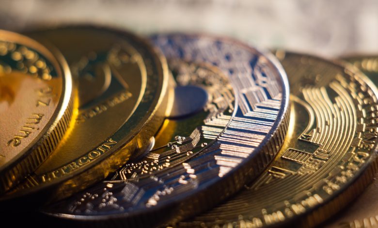 closeup shot of a pile of cryptocurrency cash golden coins